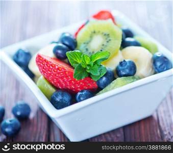 fresh fruit salad in the white bowl