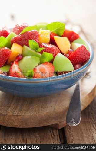 fresh fruit salad with strawberry, apple, nectarine, pomegranate