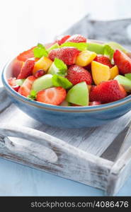 fresh fruit salad with strawberry, apple, nectarine, pomegranate