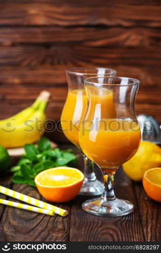 fresh fruits and juice on a table