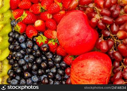 Fresh fruits concept, Healthy fruits consist of grapes apple orange and berry as background.