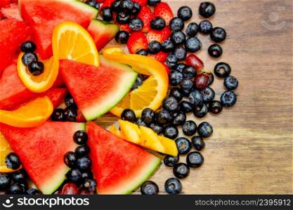 Fresh fruits concept, Healthy mix assorted fruits consist of tropical fruit and berry as background.