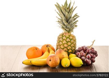 Fresh fruits on wooden table.