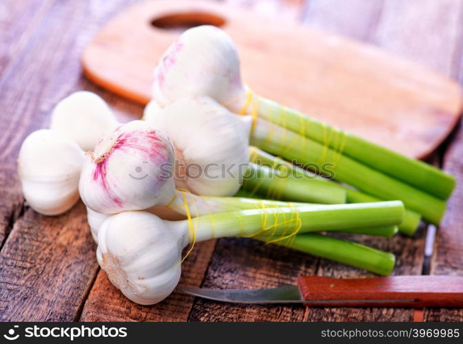 fresh garlic on the wooden table, garlic on a table