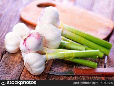 fresh garlic on the wooden table, garlic on a table