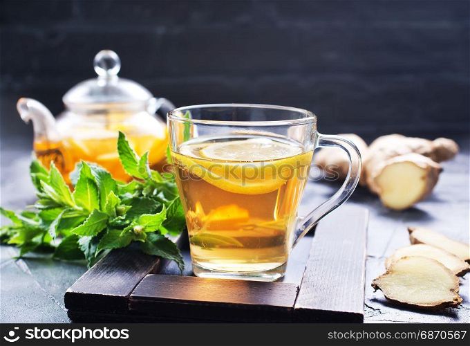 fresh ginger,herb and tea on a table
