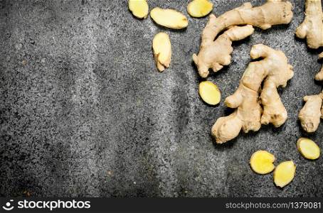 Fresh ginger root . On rustic background. Fresh ginger root .