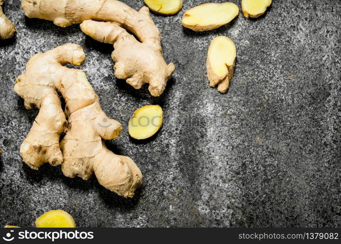 Fresh ginger root . On rustic background. Fresh ginger root .