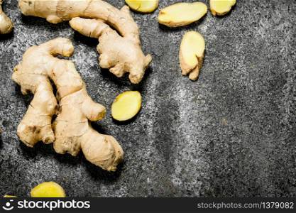 Fresh ginger root . On rustic background. Fresh ginger root .