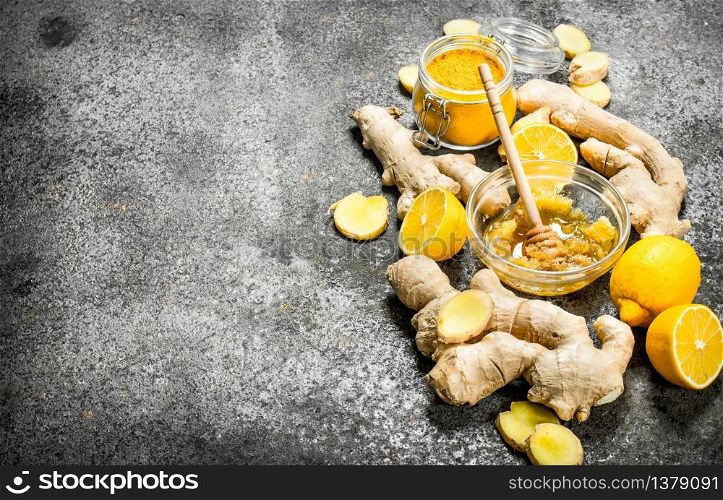 Fresh ginger with honey and lemon slices. On rustic background.. Fresh ginger with honey and lemon slices.