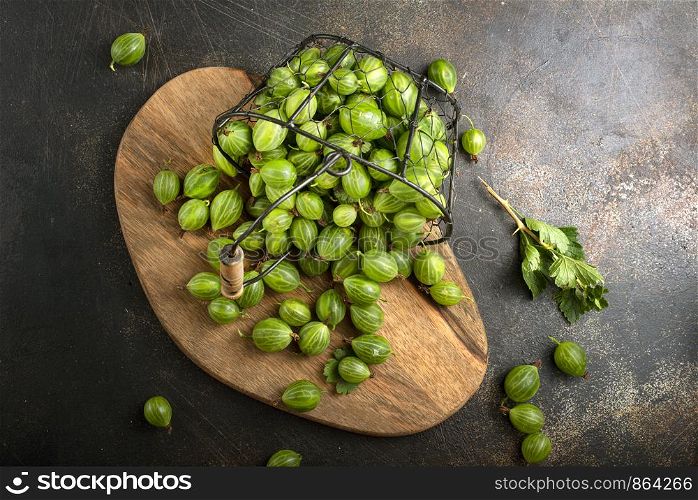 fresh gooseberry, gooseberry in metal basket on a table