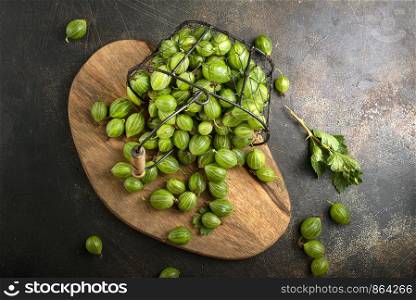 fresh gooseberry, gooseberry in metal basket on a table
