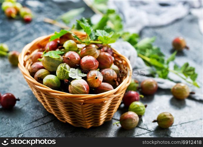 fresh gooseberry in bowl and on a table