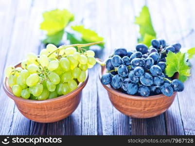 fresh grape on plate and on a table