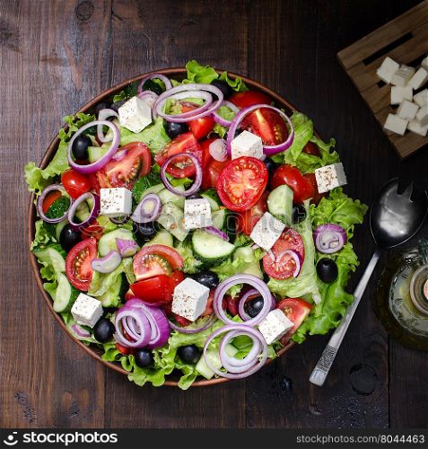 Fresh Greek salad in bowl, still life