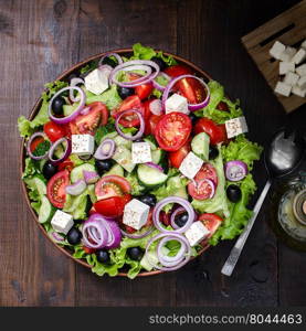 Fresh Greek salad in bowl, still life