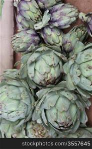 Fresh green artichokes at a Provencal market in France