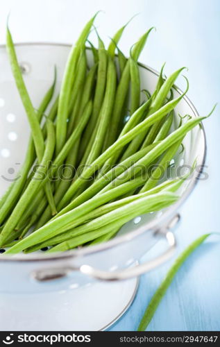 fresh green beans in colander