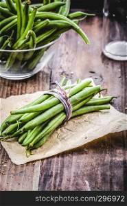 fresh green beans on a wooden background