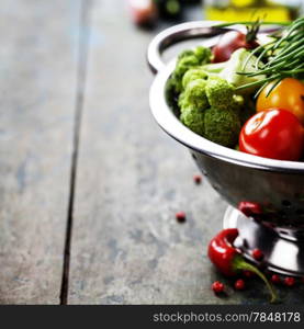 Fresh green broccoli and Healthy Organic Vegetables on a Wooden Background.