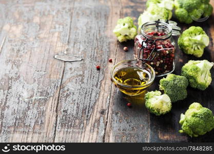 Fresh green broccoli and Healthy Organic Vegetables on a Wooden Background.