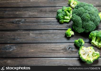 Fresh green broccoli. On a wooden background.. Fresh green broccoli.