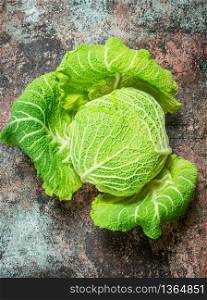 Fresh green cabbage. On rustic background. Fresh green cabbage.