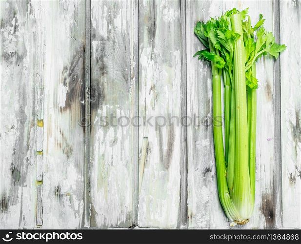 Fresh green celery. On wooden background. Fresh green celery.