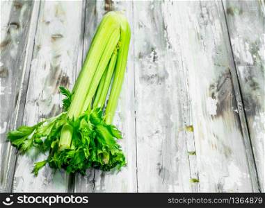 Fresh green celery. On wooden background. Fresh green celery.