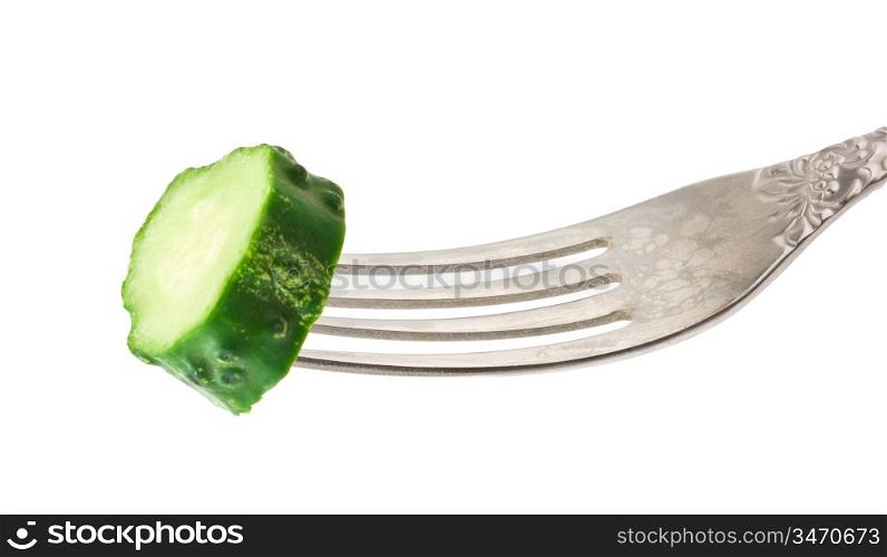fresh green cucumber at the fork isolated on white