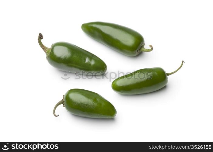 Fresh green Jalapeno chili peppers on white background