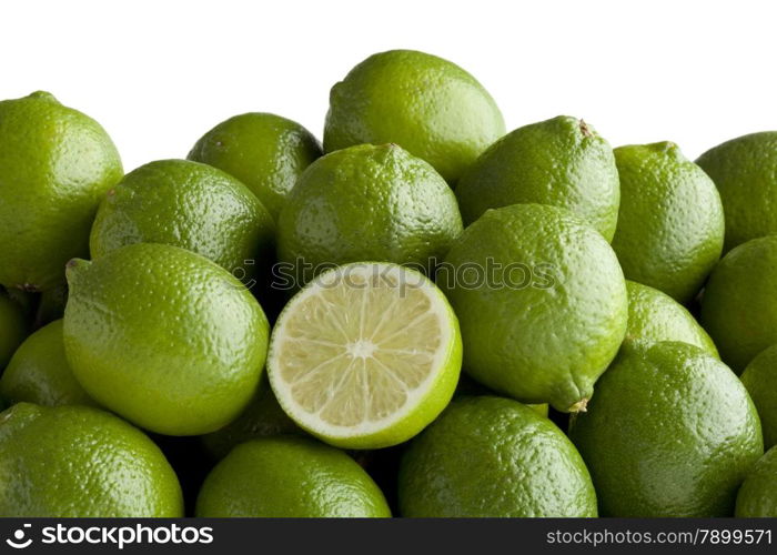 Fresh green limes and a half one