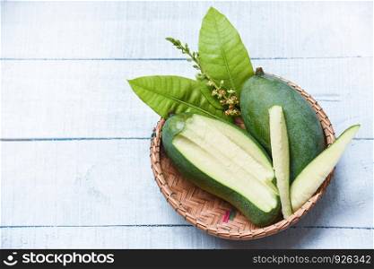 Fresh green mango and green leaves basket / Mango slice summer fruit