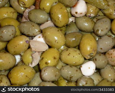 Fresh green olives with garlic and mushrooms