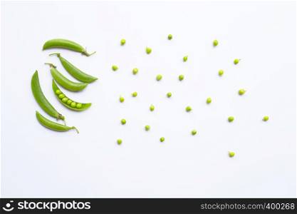 Fresh green pea pods and peas on white background