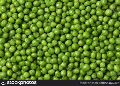 Fresh green peas close full frame as background