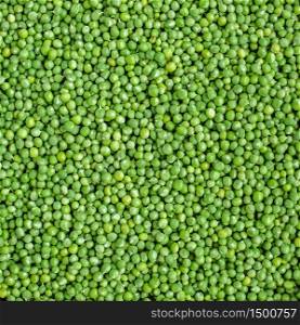 Fresh green peas in a bowl on a white table. Fresh Green Peas