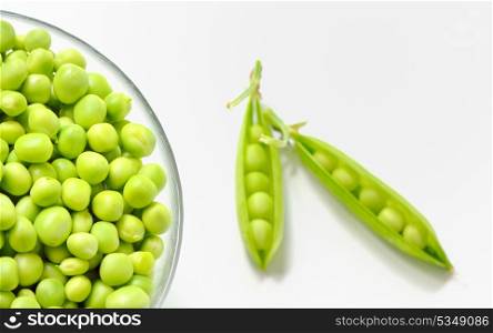Fresh green peas on an old white background shoot in studio