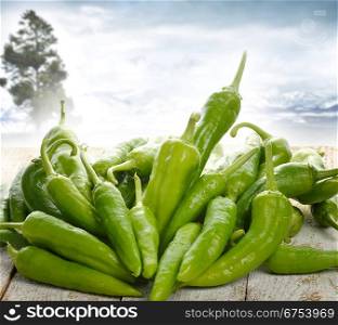 Fresh Green Pepper On A Wooden Table