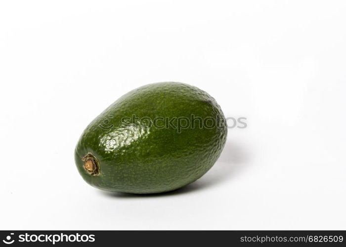 Fresh green ripe avocado whith leaf isolated on white background. Design element for product label, catalog print, web use.