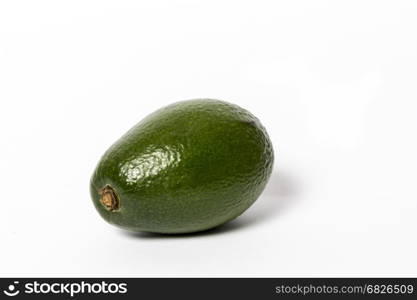 Fresh green ripe avocado whith leaf isolated on white background. Design element for product label, catalog print, web use.