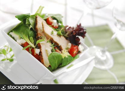 Fresh green salad with grilled chicken herbs and tomatoes