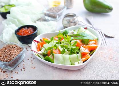 Fresh green salad with smoked salmon and cherry tomatoes