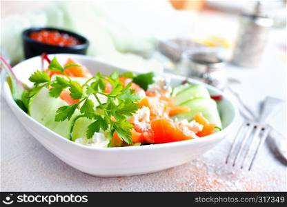 Fresh green salad with smoked salmon and cherry tomatoes
