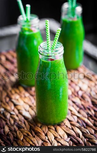 Fresh green smoothie outdoors