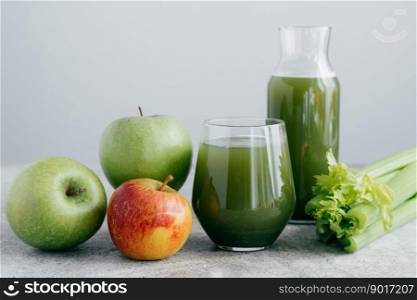 Fresh green smoothie with ingredients. Superfood and detox drink concept. Fresh apples and cerely on white background. Healthy drinking