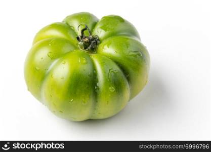 fresh green tomato on white background