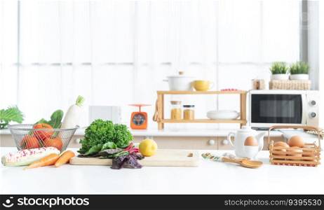 Fresh green vegetable and yellow lemon placed on cutting board, tomatoes, white radish, cos salad in basket, carrots, corn, eggs in egg stand and basket on table. Healthy food in home kitchen