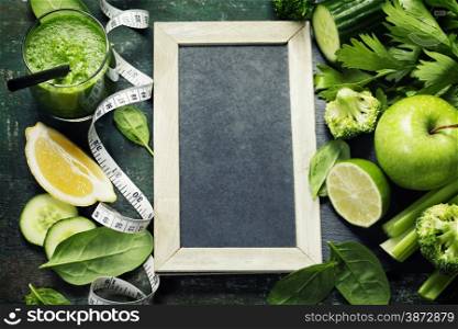 Fresh green vegetables and smoothie on vintage background - detox, diet or healthy food concept