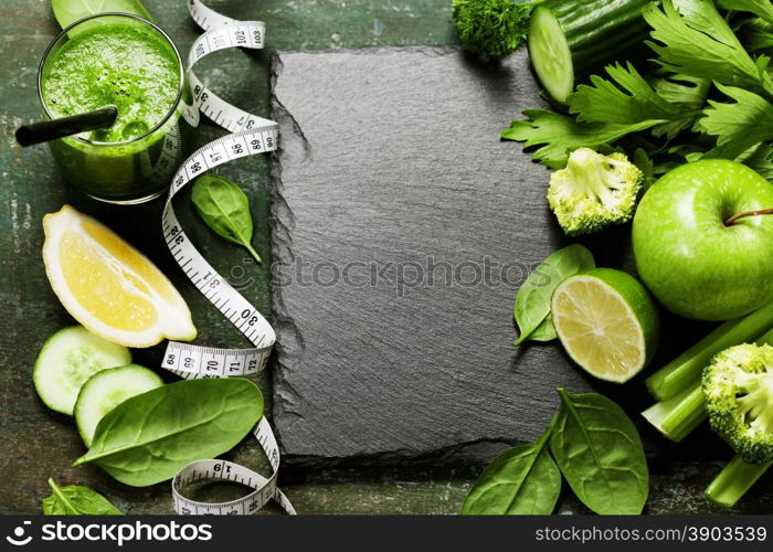 Fresh green vegetables and smoothie on vintage background - detox, diet or healthy food concept